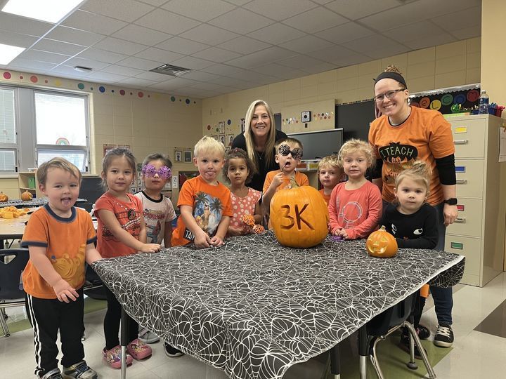 3K students with pumpkin